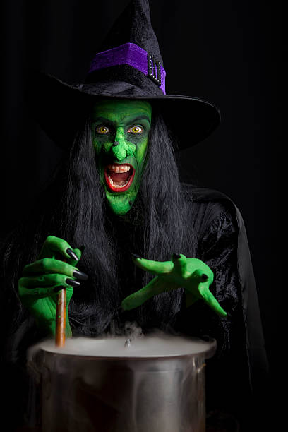 istock Scary witch stirring a smoky cauldron 176839952