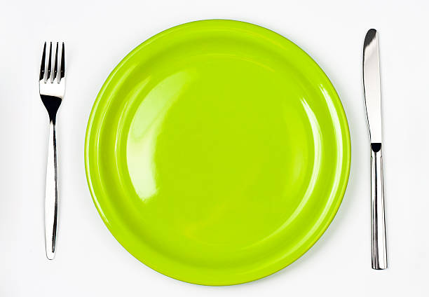 istock Knife, bright green plate and fork isolated in white 176842071