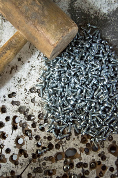 istock screw and wooden hammer 1768420887