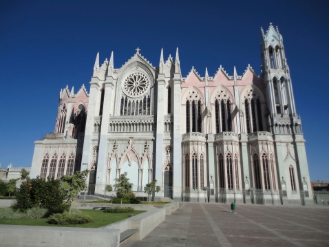 Photo of the templo expiatorio church in leon guanajuato mexico.  This catholic church dates from the 19th century and features beautiful gothic architecture.  Pictured here is the church and large courtyard.