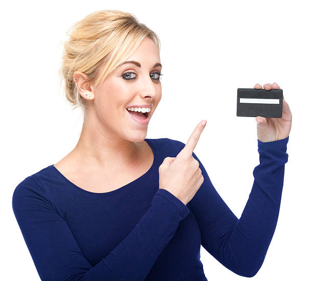 istock Attractive Young Woman Pointing At Credit Card 176842304