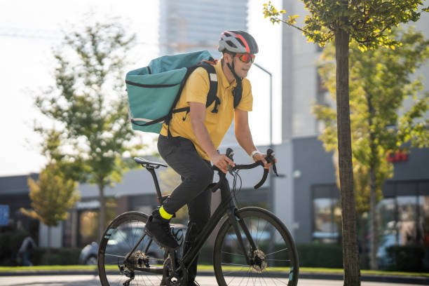 istock Delivery man on bicycle in city 1768427106