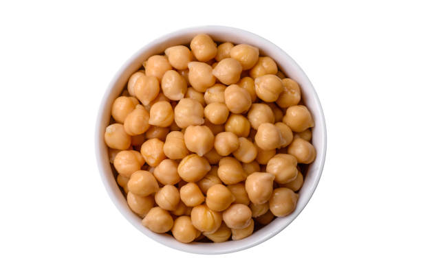 istock Delicious canned chickpeas in a ceramic plate on a dark concrete background 1768429828
