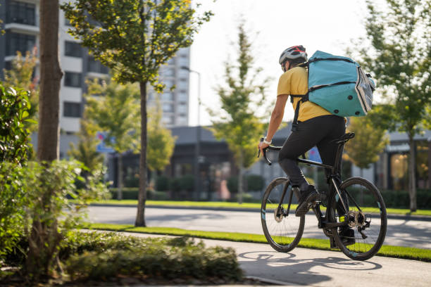 istock Delivery man on bicycle in city 1768430913