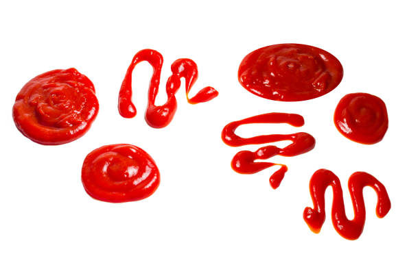 istock Ketchup and yellow sauce splashes isolated on white background. 1768430933