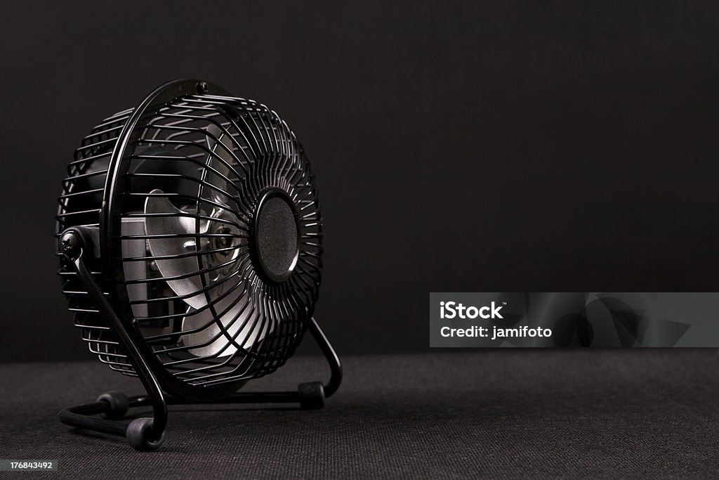 Cooler fan Small cooler fan on black background Air Duct Stock Photo