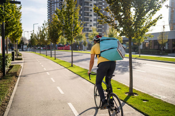 istock Delivery man on bicycle in city 1768436600