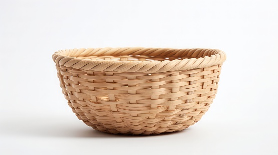 An empty rustic basket featuring a woven rope design on the rim