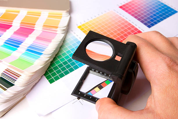 istock Holding a lupe and examing colours 176844460
