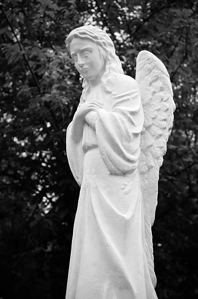 istock Statue of crying angel. Black and white 176844811