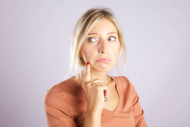 istock Beautiful young woman thinking 176844895