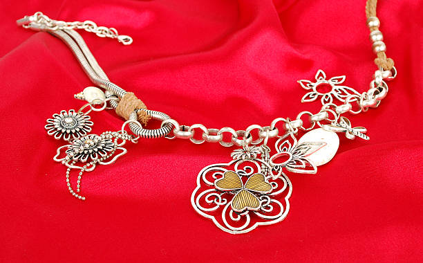 istock Silver necklace  on the red silk 176845000