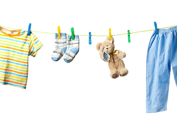istock Baby clothes and a teddy bear 176845515