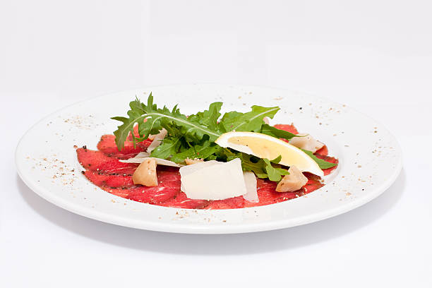 istock Red fish with lemon and leaves on a plate 176845571