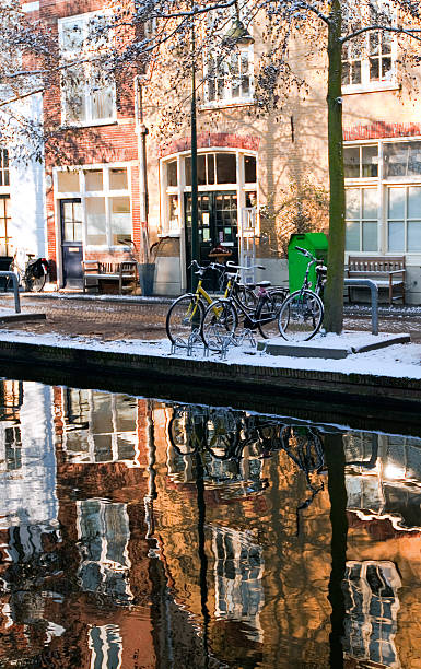 House reflection in the canal of Delft House reflection in the canal of Delft. vertical shot delft winter netherlands snow stock pictures, royalty-free photos & images