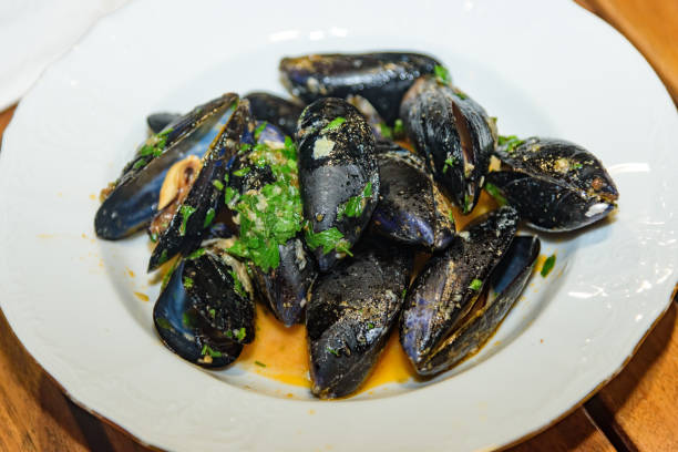 istock Preparing sea mussels for eat 1768462883