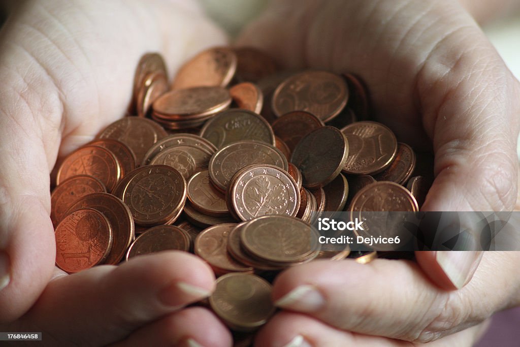 Small change in hands EuromAnzen collected in houses Cent Sign Stock Photo