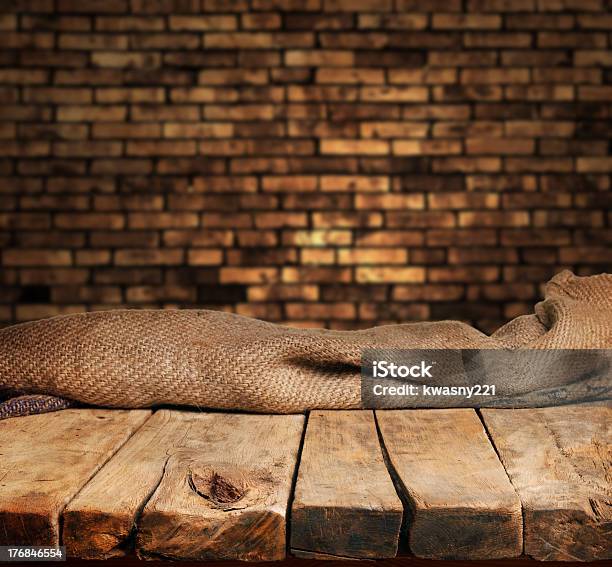 Empty Wood Table With Brick Backdrop Stock Photo - Download Image Now - Abstract, Advertisement, Aging Process