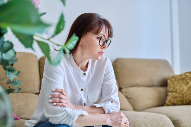 istock Middle-aged woman experiencing stress, difficulties, headache 1768465735
