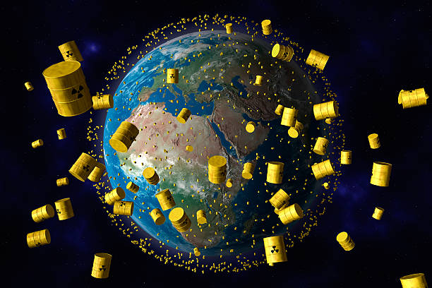 istock yellow barrels of nuclear waste orbit the planet earth 176846636