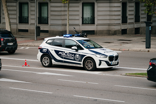 Madrid, Spain - 28 October, 2023: A BMW 2 series used by Madrid police in a street of the spanish capital city