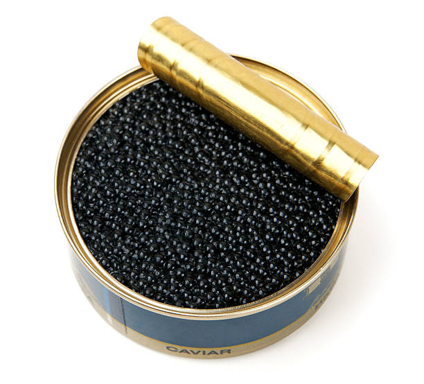istock Opened tin of black caviar on a white background 176847027