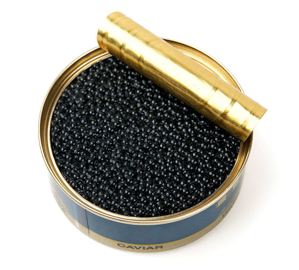 Opened tin of black caviar on a white background Black caviar in metal can isolated on white caviar stock pictures, royalty-free photos & images
