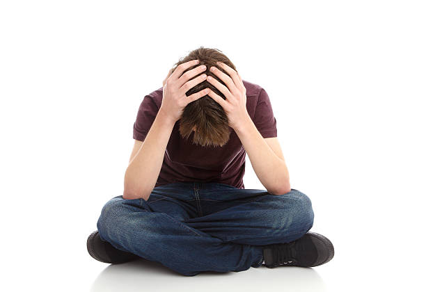 istock Teen boy head in hands 176847796