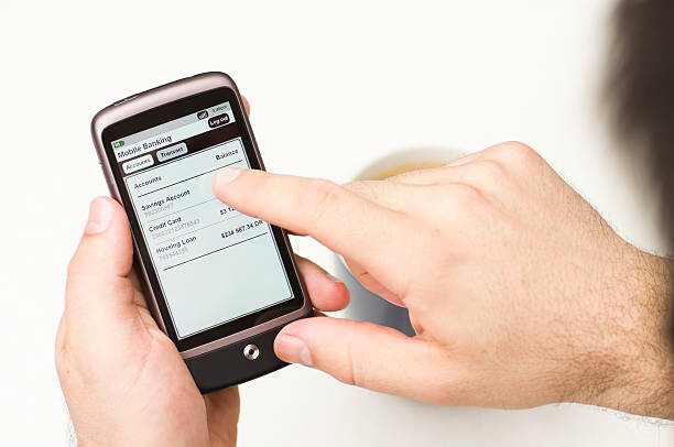 istock Man checks Mobile Banking details on a Smartphone 176847820