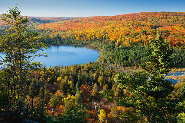 istock Small lake surrounded by hills with Fall color 176847873
