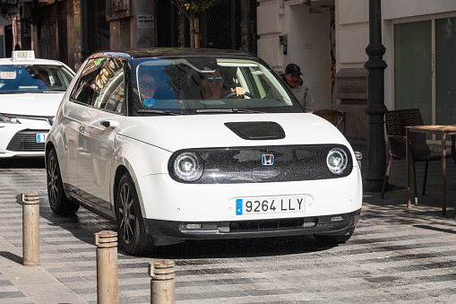 Madrid, Spain - 28 October, 2023: An electric Honda E car in a street of Madrid, Spain