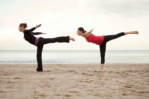 istock Two young women doing yoga 176848058
