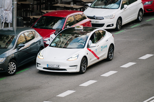 Madrid, Spain - 28 October, 2023: A Tesla Model 3 used as a taxi car in Madrid, Spain