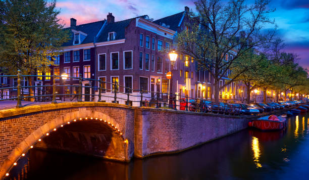 istock Amsterdam, Netherlands. Bridges with nighttime illumination over 1768484189
