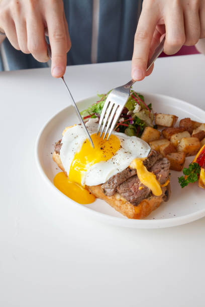 istock Breakfast egg and roast beef open faced sandwich served at a cafe restaurant. 1768489250