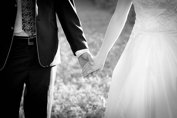 istock Young married couple holding hands 176848933