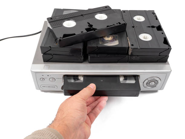 istock VHS cassette video recorder on a white background. 1768490299