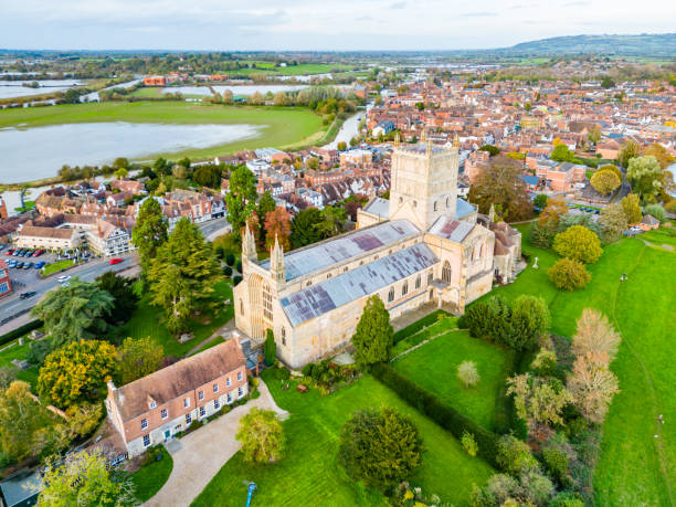 istock Tewksbury Abbey with town behind 1768490855
