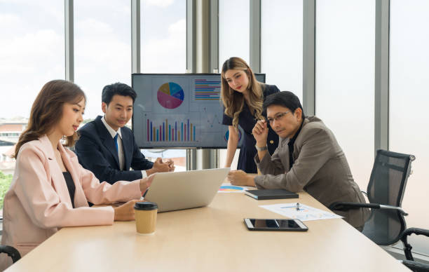 istock High-powered business professionals discussing strategic plans and making decisions at a conference table in a professional office setting. 1768493505