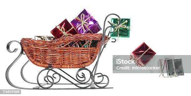 Christmaspresents Spilling Out Ot Santas Sleigh Isolated Background Stock Photo - Download Image Now