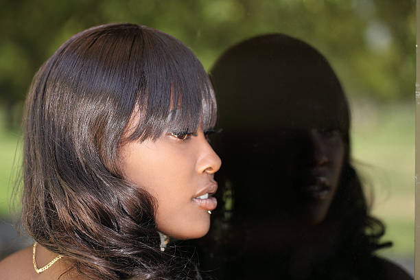istock Profile young African American woman reflection window 176849457