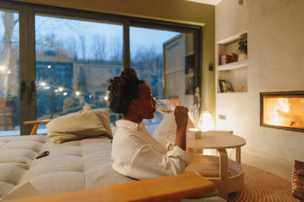 istock Enjoying wine by the fireplace 1768496991