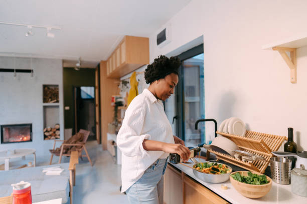 istock Young woman preparing a delicious dinner 1768497006