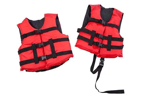 "Red and black children's life jackets, child and youth sizes, isolated on white"