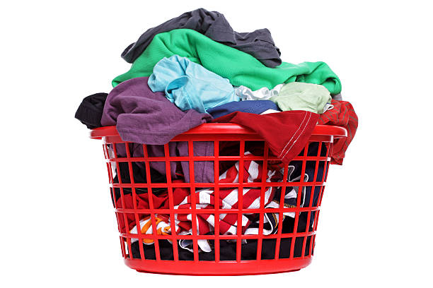 istock A laundry basket full of multicolored clothes 176850006