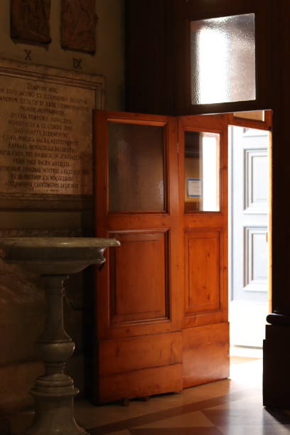 istock View through a dark open doorway onto a bright sunny town piazza 1768503558