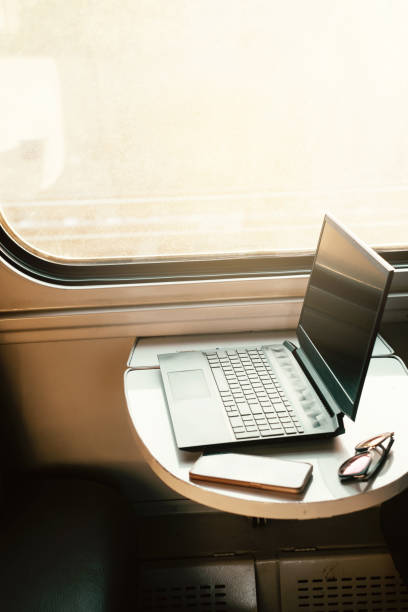 istock Laptop in train on the table by the window. Business trip 1768505813