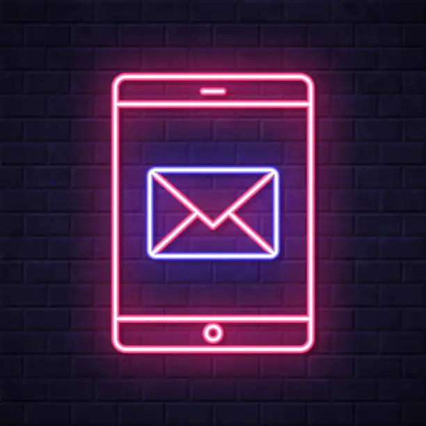 Vector illustration of Tablet PC with email message. Glowing neon icon on brick wall background