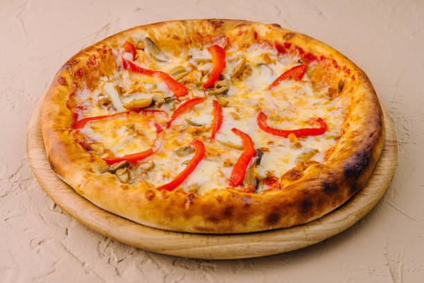 istock Delicious pizza with chicken, pepper and mushrooms 1768510756