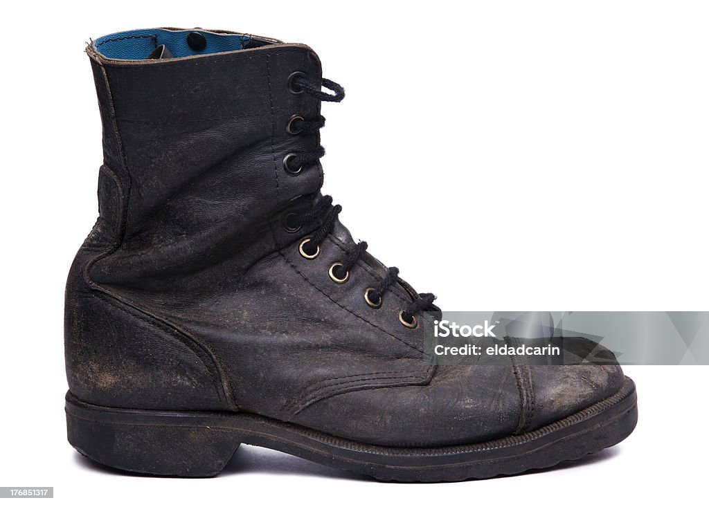 Isolated Used Army Boot - Side View "Side view of a very worn right boot, issued by the Israeli army (IDF). isolated on white background." Dirty Stock Photo